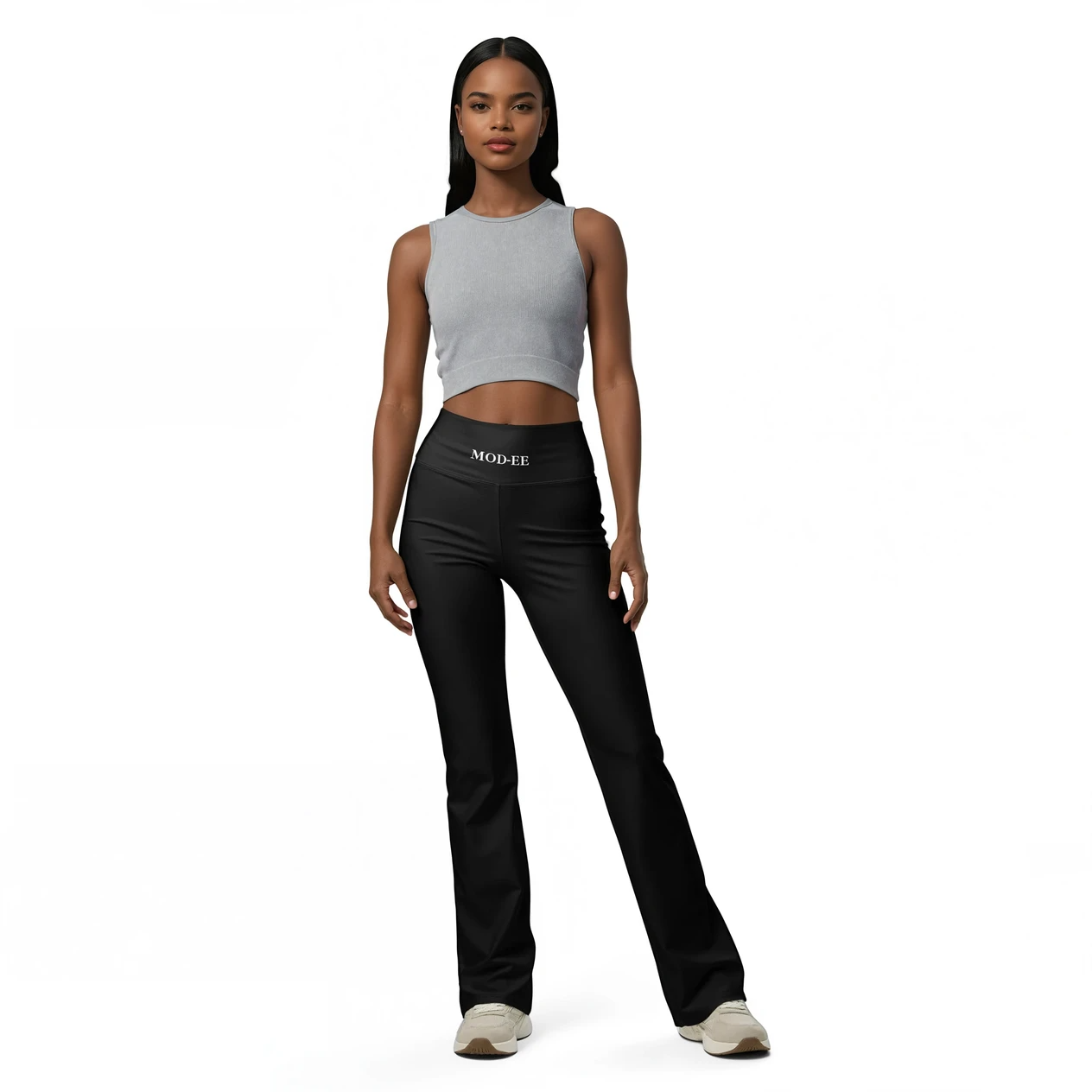 Legging évasé noir Mod-ee, une taille haute et un tissu doux, doté d'une protection UPF 50+ et conçu pour une évacuation efficace de l'humidité, idéal pour une pratique sportive dans un confort optimal.