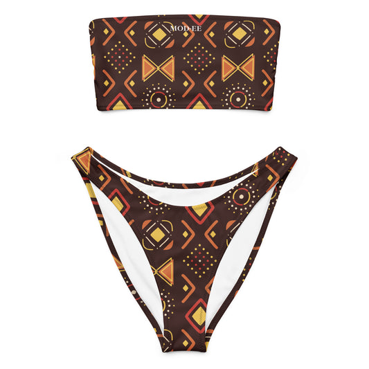 Adoptez un look à la fois élégant, moderne et écoresponsable avec ce bikini bandeau imprimé wax conçu pour sublimer toutes les silhouettes. Que ce soit pour une journée à la plage, un moment détente au bord de la piscine ou pour profiter du soleil en toute liberté, ce maillot est votre allié idéal.