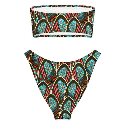 Adoptez un look à la fois élégant, moderne et écoresponsable avec ce bikini bandeau imprimé wax conçu pour sublimer toutes les silhouettes. Que ce soit pour une journée à la plage, un moment détente au bord de la piscine ou pour profiter du soleil en toute liberté, ce maillot est votre allié idéal.