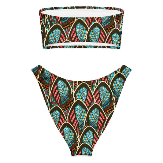 Adoptez un look à la fois élégant, moderne et écoresponsable avec ce bikini bandeau imprimé wax conçu pour sublimer toutes les silhouettes. Que ce soit pour une journée à la plage, un moment détente au bord de la piscine ou pour profiter du soleil en toute liberté, ce maillot est votre allié idéal.