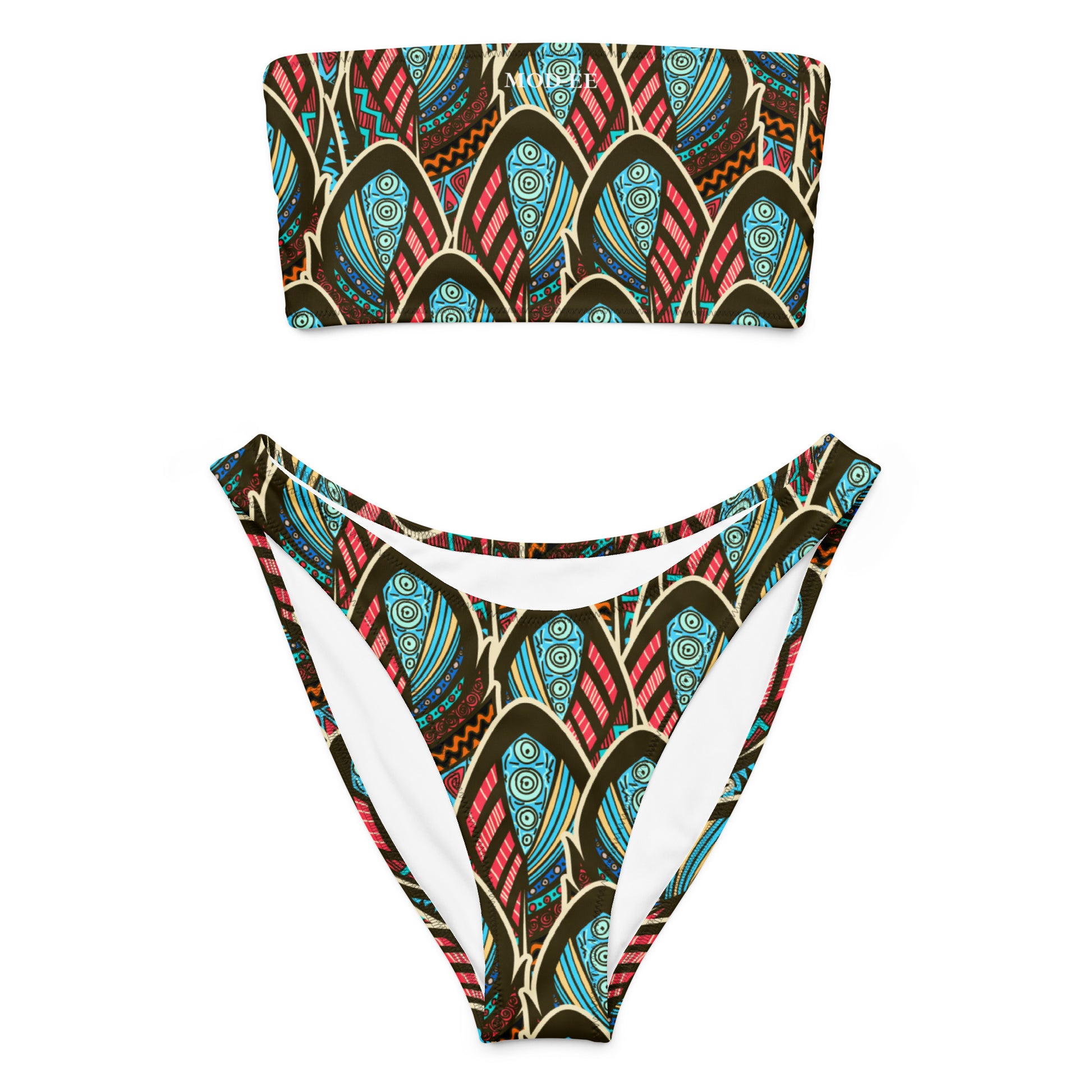Adoptez un look à la fois élégant, moderne et écoresponsable avec ce bikini bandeau imprimé wax conçu pour sublimer toutes les silhouettes. Que ce soit pour une journée à la plage, un moment détente au bord de la piscine ou pour profiter du soleil en toute liberté, ce maillot est votre allié idéal.