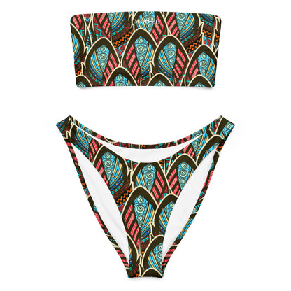 Adoptez un look à la fois élégant, moderne et écoresponsable avec ce bikini bandeau imprimé wax conçu pour sublimer toutes les silhouettes. Que ce soit pour une journée à la plage, un moment détente au bord de la piscine ou pour profiter du soleil en toute liberté, ce maillot est votre allié idéal.