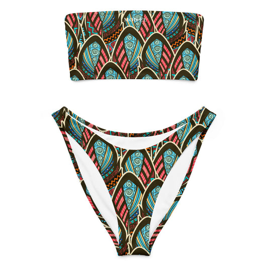 Adoptez un look à la fois élégant, moderne et écoresponsable avec ce bikini bandeau imprimé wax conçu pour sublimer toutes les silhouettes. Que ce soit pour une journée à la plage, un moment détente au bord de la piscine ou pour profiter du soleil en toute liberté, ce maillot est votre allié idéal.