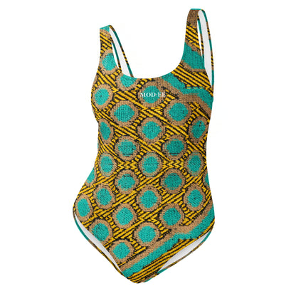 Maillot de bain imprimé wax une pièce Mod-ee, présentant une coupe ajustée et un dos plongeant, réalisé dans un matériau extensible pour un maintien optimal et un confort raffiné lors de vos activités aquatiques.