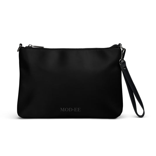 Sac bandoulière noir Mod-ee, équipé de bretelles amovibles et d’une fermeture à glissière sécurisée, doté de nombreuses poches intérieures pour organiser vos essentiels, alliant praticité et élégance pour un usage quotidien.