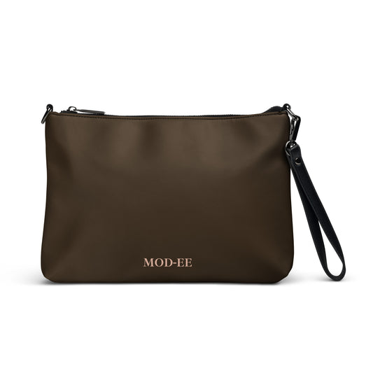 Sac bandoulière brun Mod-ee, équipé de bretelles amovibles et d’une fermeture à glissière sécurisée, doté de nombreuses poches intérieures pour organiser vos essentiels, alliant praticité et élégance pour un usage quotidien.